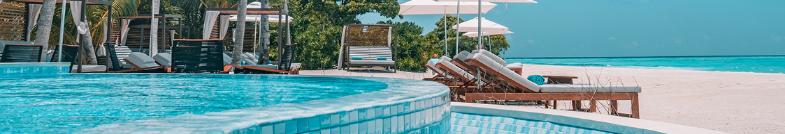 Resort poolside with loungers and umbrellas